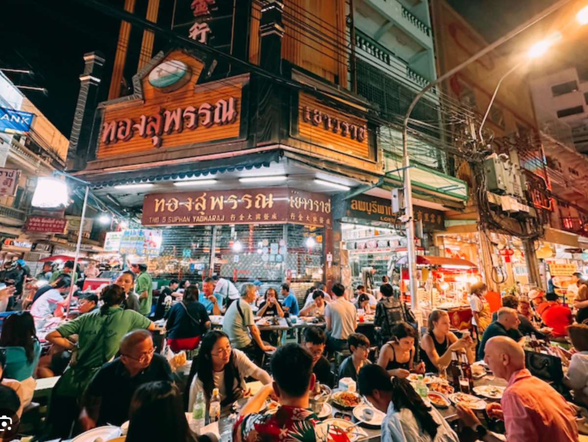 Evening street-food dining on Yaowarat Road in Bangkok's Chinatown